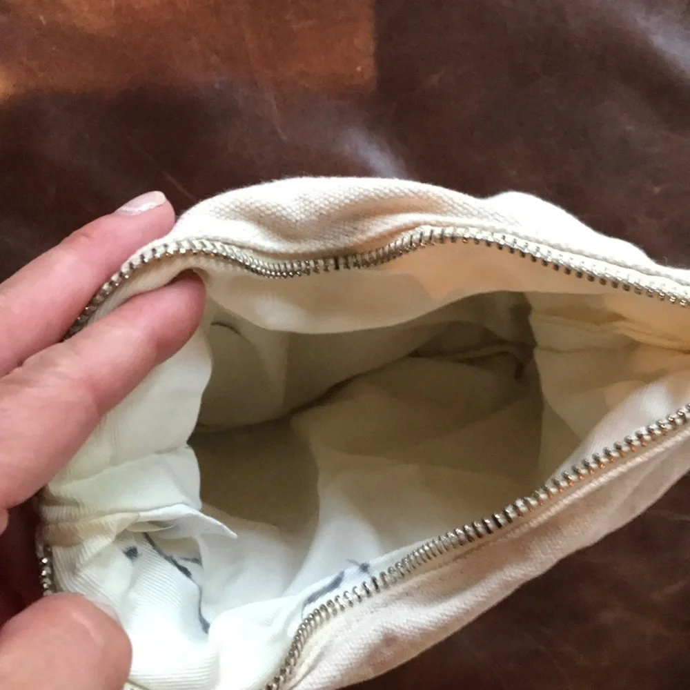 Cosmetic or pencil bag with vinyl orange bottom